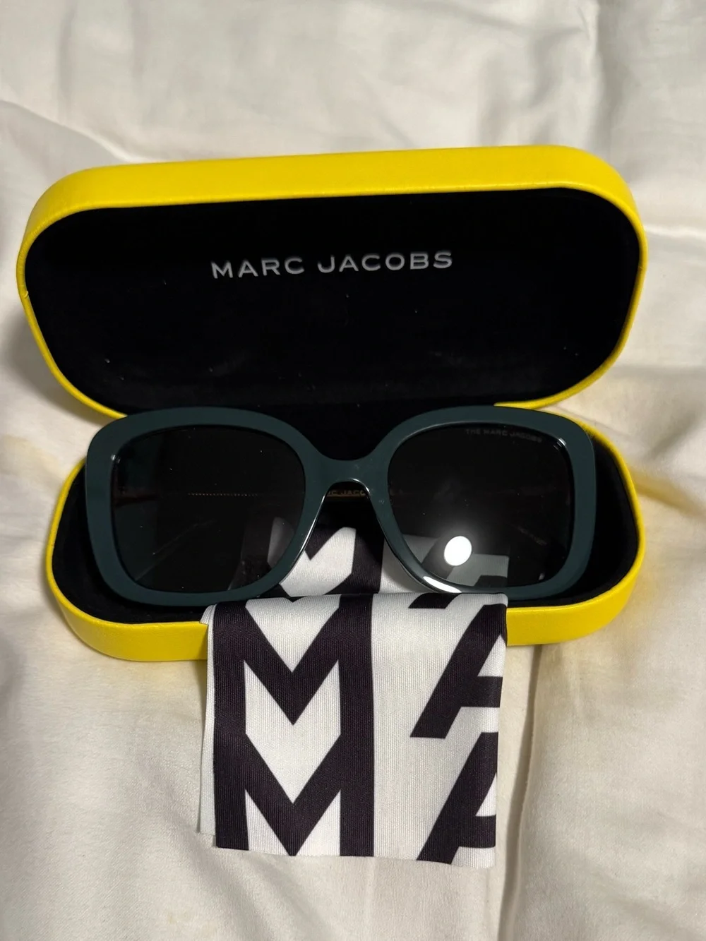 Marc Jacobs Woman’s Dark Teal Square Sunglasses with alternating pink hues! New